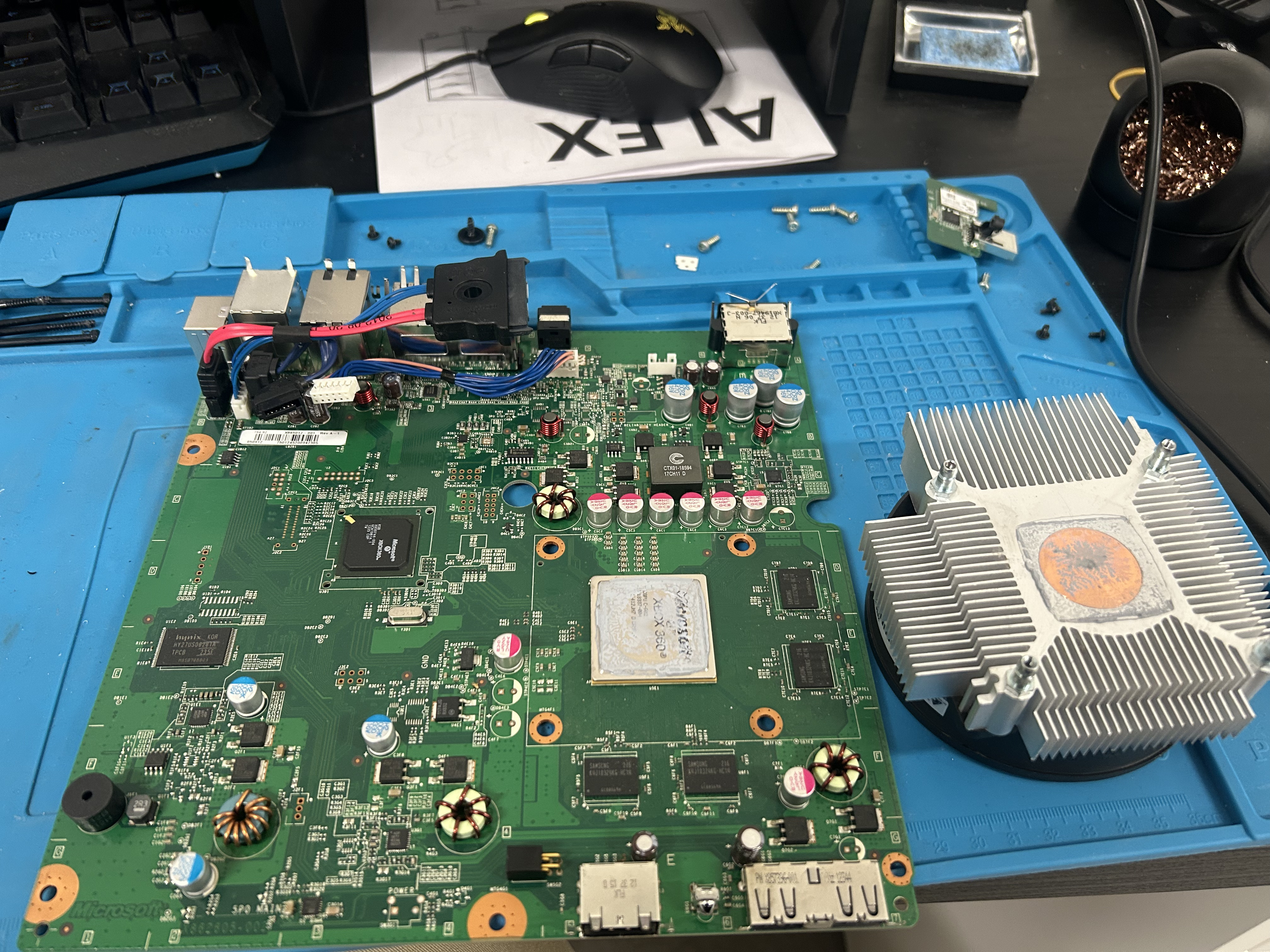 Disassembled board with old dried thermal paste